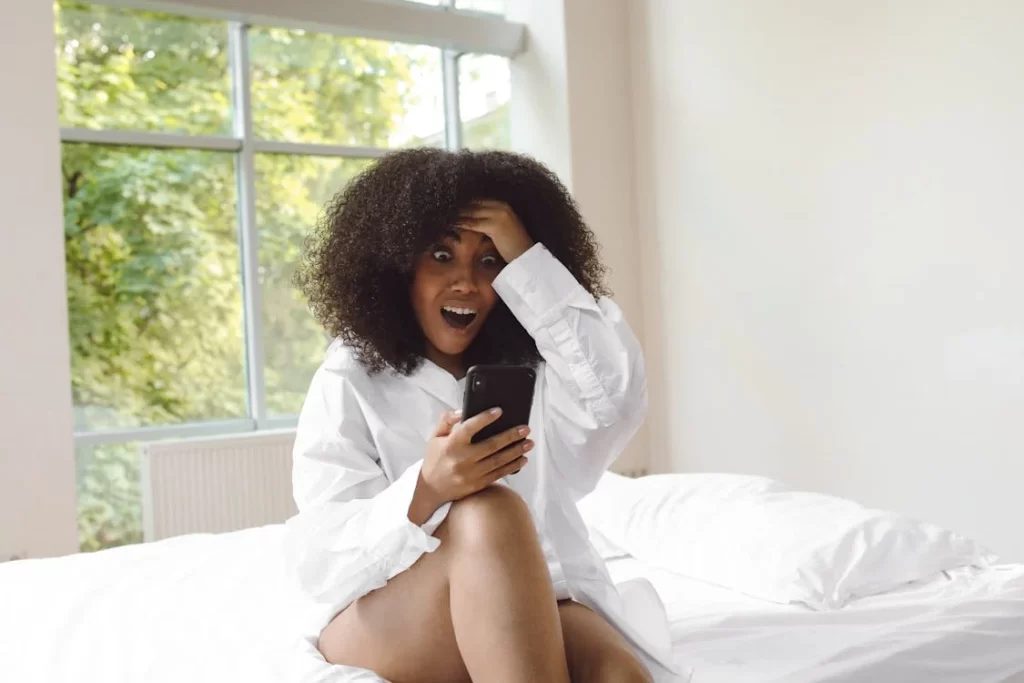 Woman shocked at her phone