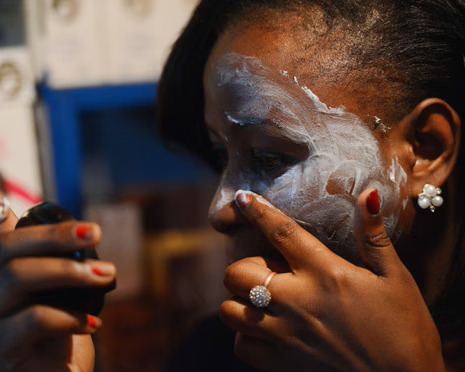 Woman applying lotion on her skin. Credit: Guardian