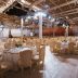 Elegant indoor event hall with banquet seating and decorative lighting