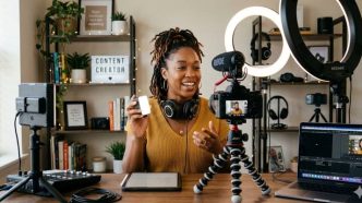 Female Content Creator recording a video in a home studio