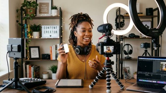 Female Content Creator recording a video in a home studio