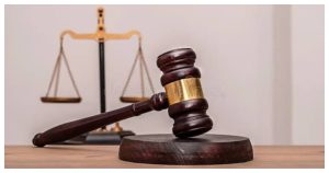 Judge's gavel and hourglass illustrating a concurrent sentence versus a consecutive sentence in Nigeria