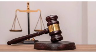 Judge's gavel and hourglass illustrating a concurrent sentence versus a consecutive sentence in Nigeria