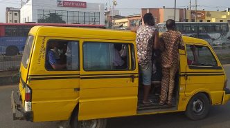 Nigerian commuters in a commercial yellow bus
