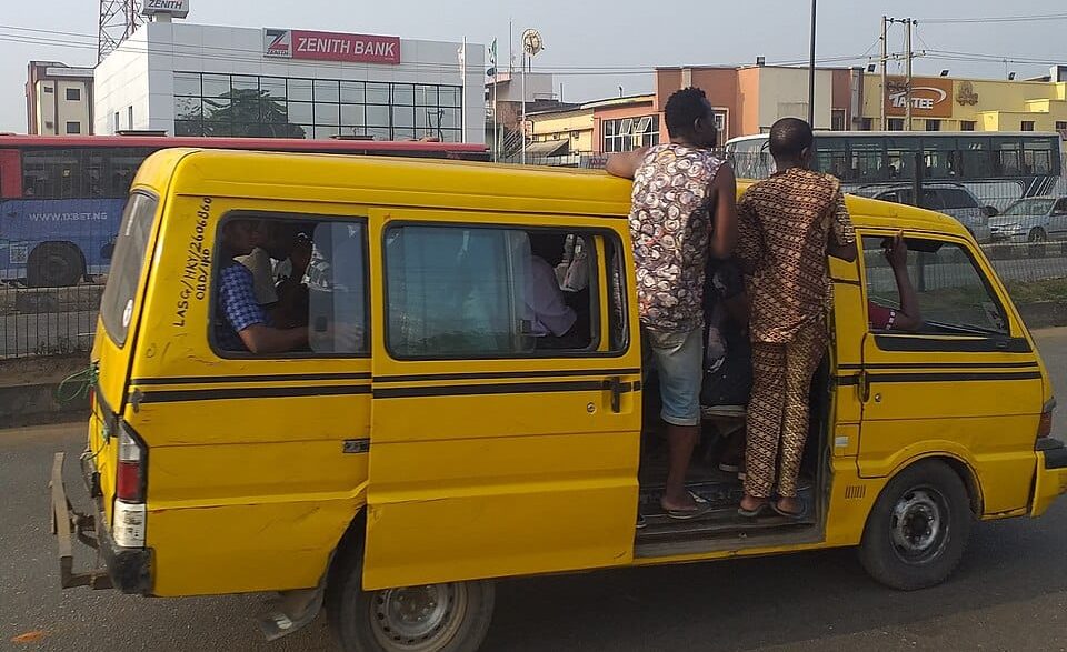 Nigerian commuters in a commercial yellow bus
