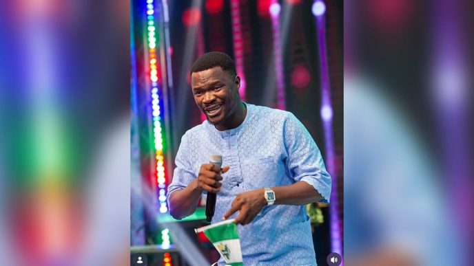 Toluwanisings performing on stage during a gospel music event