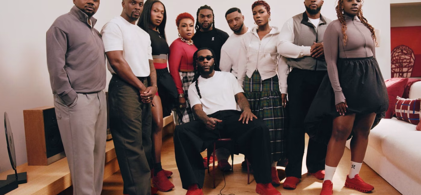 Burna Boy with family and collaborators in the No Giant Stands Alone campaign